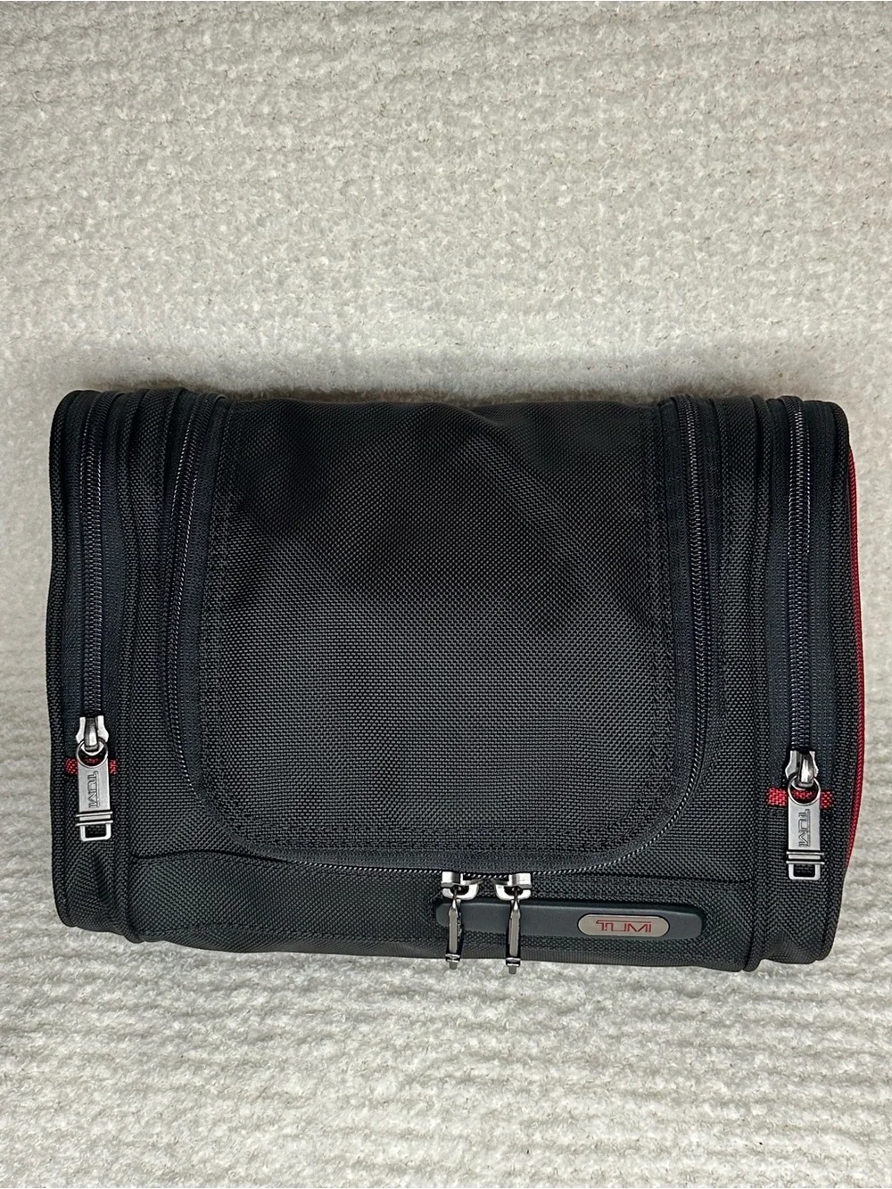 Tumi Black Toiletry Bag with Red Accents